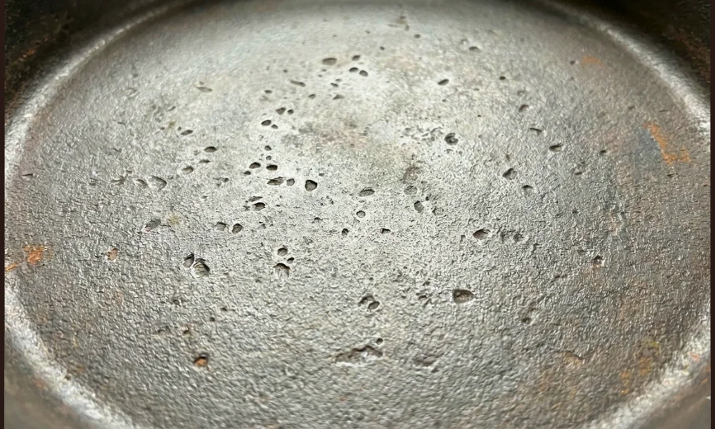 Close view of rusted cast iron surface showing surface-level oxidation