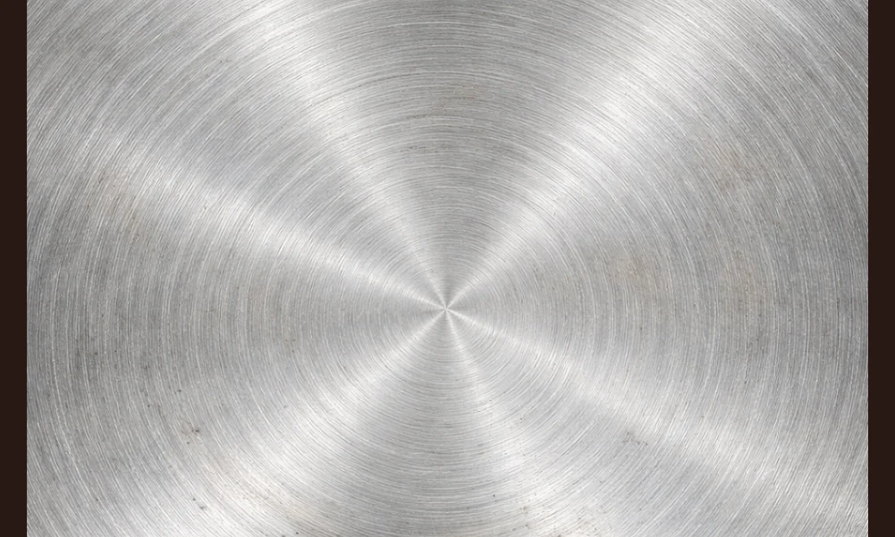 Close-up of cookware surface texture showing fine wear patterns