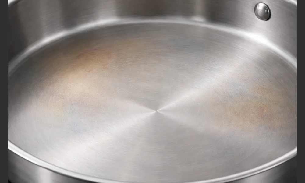 Stainless steel cookware showing cosmetic discoloration without structural damage