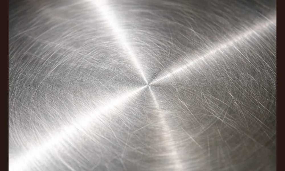 Close-up of stainless steel surface texture affecting residue and appearance