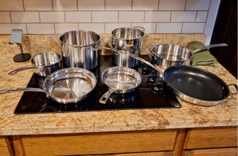 Cuisinart MultiClad Pro 15-piece cookware set arranged on a kitchen cooktop